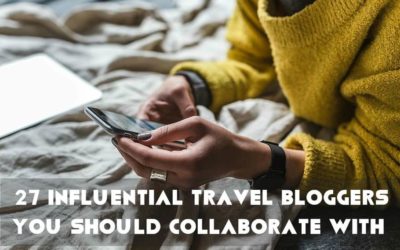 Travel Influencer texting on his blog to collaborate with brands
