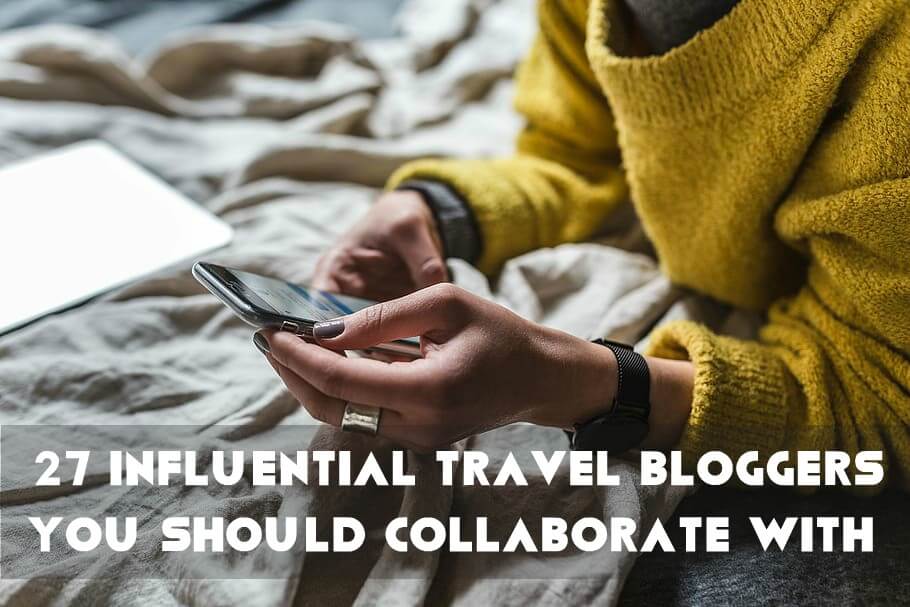 Travel Influencer texting on his blog to collaborate with brands