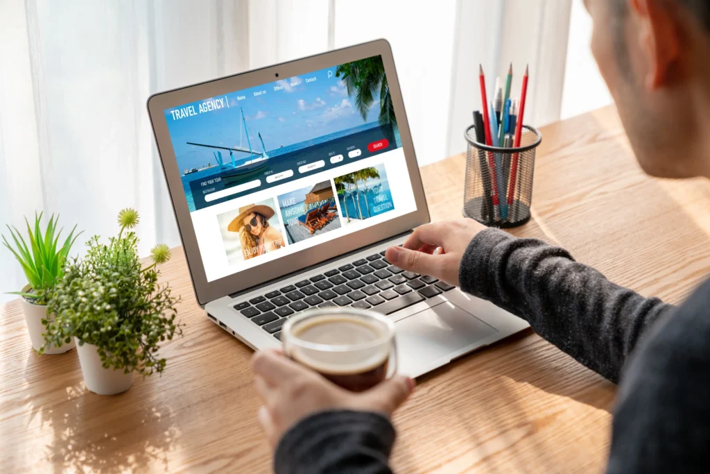 Traveler navigating a personalized travel agency website to plan a holiday